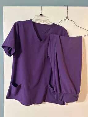 2 piece deep purple scrub set with V neck top and jogger style scrub pants